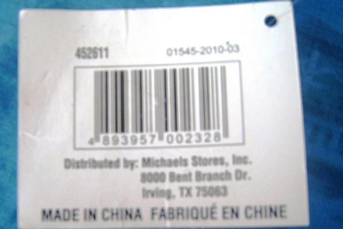 Этикетка с упаковки для мячиков на английском и частично на французском языке