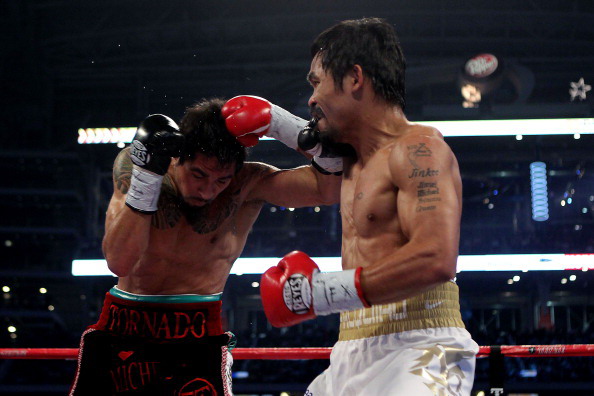 Мэнни Пакьяо одержал победу над Маргарито.  Фото: TOM PENNINGTON, ROBYN BECK /Getty Images