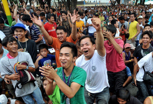 Мэнни Пакьяо одержал победу над Маргарито.  Фото: TOM PENNINGTON, ROBYN BECK /Getty Images
