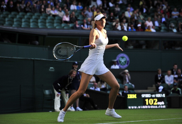 Фоторепортаж с матча: Мария Шарапова  выиграла у Анны Чакветадзе. Фото: Clive Brunskill /Michael Regan/ GLYN KIRK/AFP/Getty Images