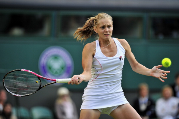 Фоторепортаж с матча: Мария Шарапова  выиграла у Анны Чакветадзе. Фото: Clive Brunskill /Michael Regan/ GLYN KIRK/AFP/Getty Images
