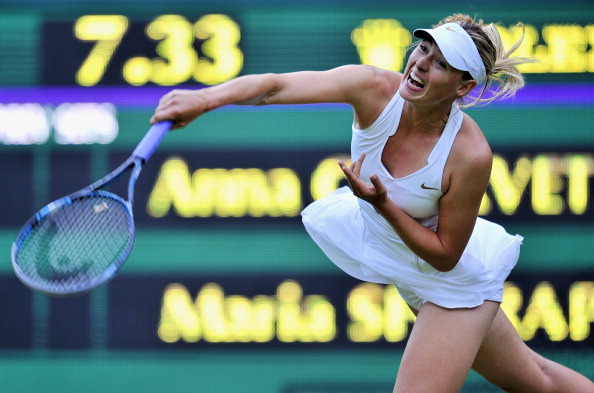 Фоторепортаж с матча: Мария Шарапова  выиграла у Анны Чакветадзе. Фото: Clive Brunskill /Michael Regan/ GLYN KIRK/AFP/Getty Images