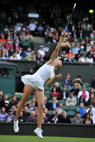 Фоторепортаж с матча: Мария Шарапова  выиграла у Анны Чакветадзе. Фото: Clive Brunskill /Michael Regan/ GLYN KIRK/AFP/Getty Images