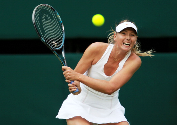 Фоторепортаж с матча: Мария Шарапова  выиграла у Анны Чакветадзе. Фото: Clive Brunskill /Michael Regan/ GLYN KIRK/AFP/Getty Images