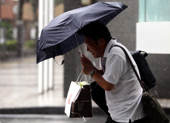 Фоторепортаж о наводнение в Японии, вызванного тайфуном «Талас». Фото: Buddhika Weerasinghe / Getty Images Фоторепортаж о наводнение в Японии, вызванного тайфуном «Талас». Фото: Buddhika Weerasinghe / Getty Images
