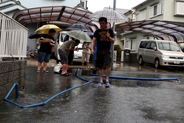 Фоторепортаж о наводнение в Японии, вызванного тайфуном «Талас». Фото: Buddhika Weerasinghe / Getty Images Фоторепортаж о наводнение в Японии, вызванного тайфуном «Талас». Фото: Buddhika Weerasinghe / Getty Images
