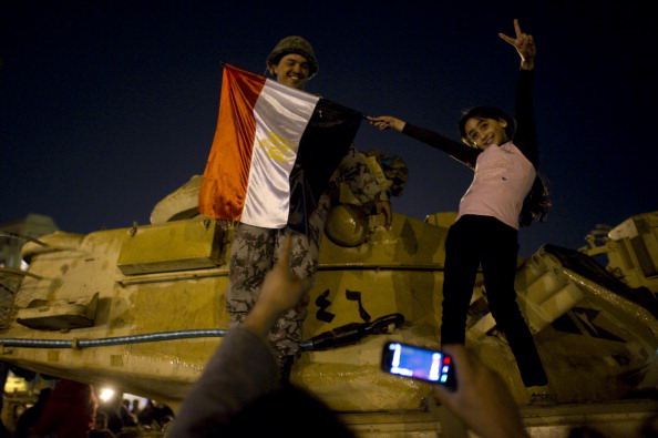 Хосни Мубарак покинул пост главы Египта. Фоторепортаж. Фото: PEDRO UGARTE, GREG WOOD,  /AFP/Getty Images