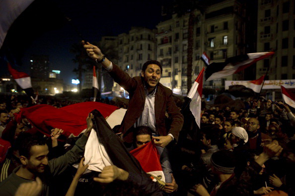 Хосни Мубарак покинул пост главы Египта. Фоторепортаж. Фото: PEDRO UGARTE, GREG WOOD,  /AFP/Getty Images