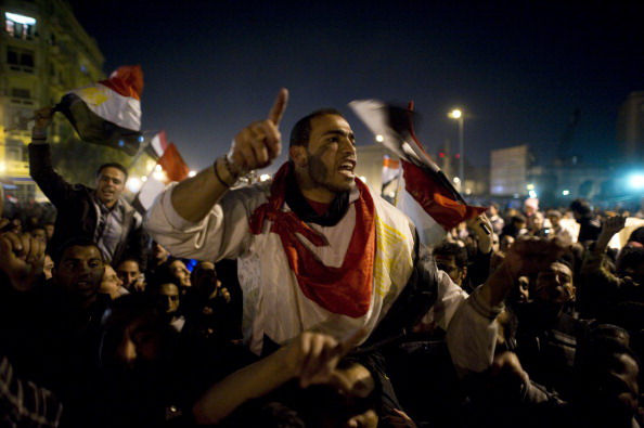 Хосни Мубарак покинул пост главы Египта. Фоторепортаж. Фото: PEDRO UGARTE, GREG WOOD,  /AFP/Getty Images