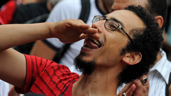 Хосни Мубарак покинул пост главы Египта. Фоторепортаж. Фото: PEDRO UGARTE, GREG WOOD,  /AFP/Getty Images