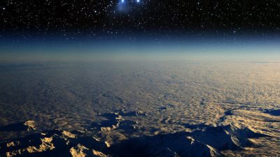 Вид на Землю из космоса и звёздное скопление Плеяды. Фото: Shutterstock*