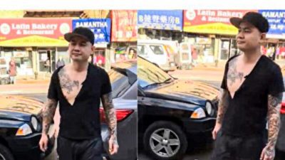 Татуированный мужчина сломал информационные стенды Фалуньгун во Флашинге